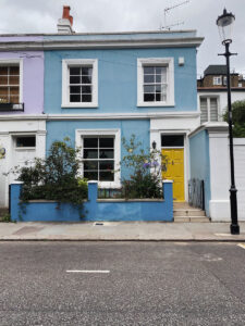 Yellow wooden door on street level
